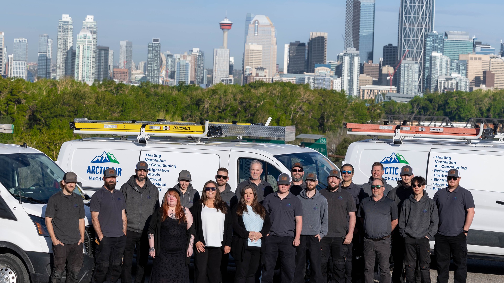 Arctic Air team with Calgary skyline